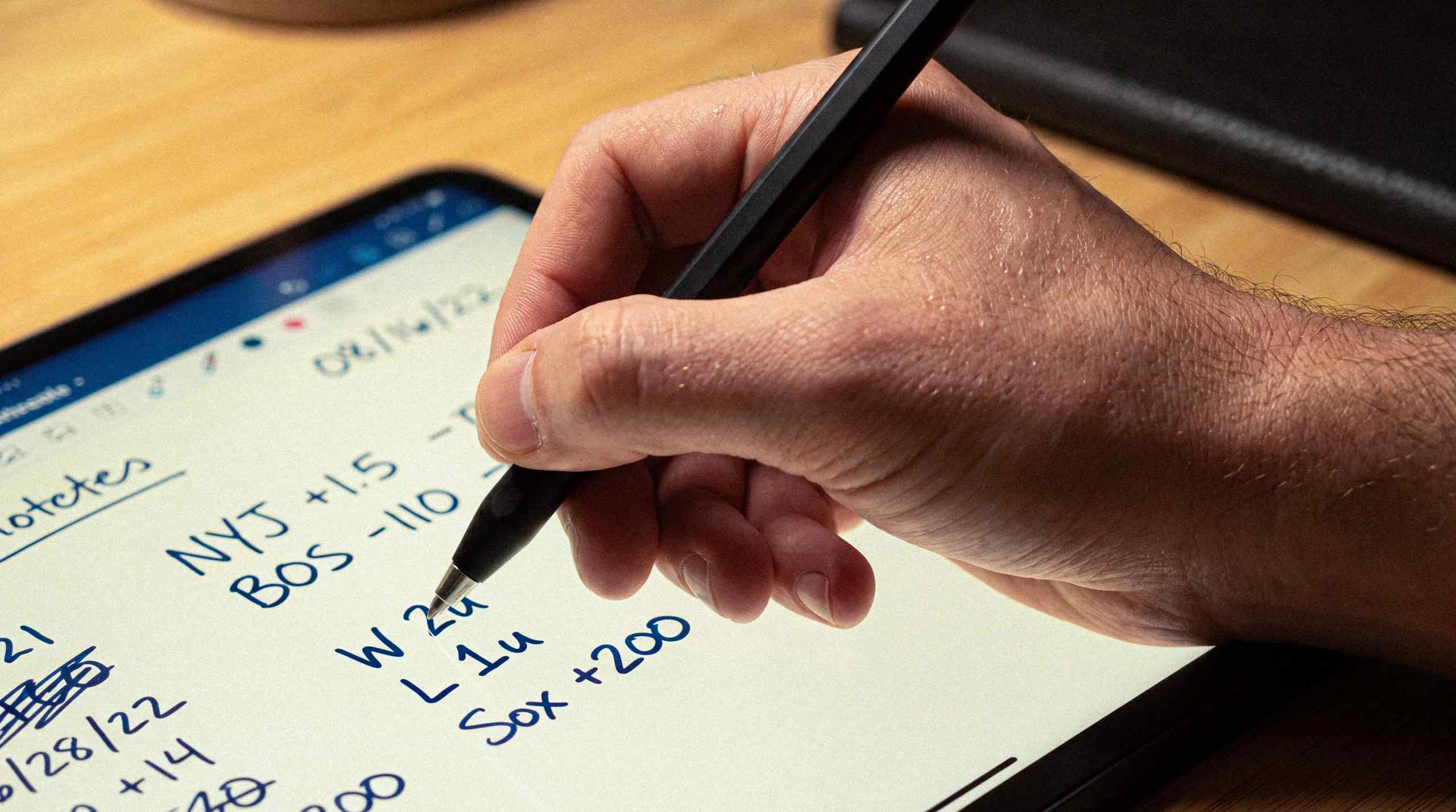 A tablet that features a number of sports bedding odds.